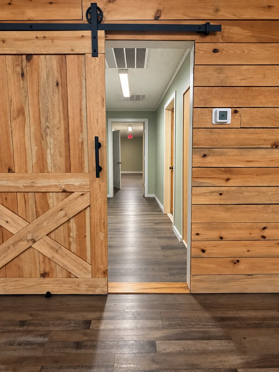 A wooden barn door slid open to the hallway where Pineview Kids and Godly C.H.A.O.S. meet
